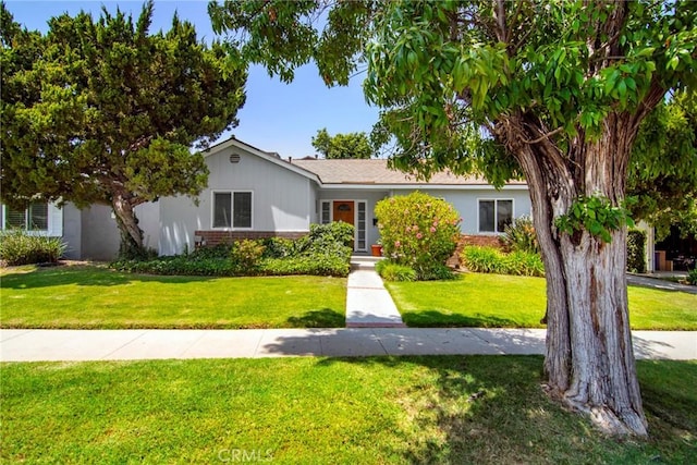 5655 Wish Ave, Encino, CA 91316 - ranch-style home featuring brick siding and a front yard