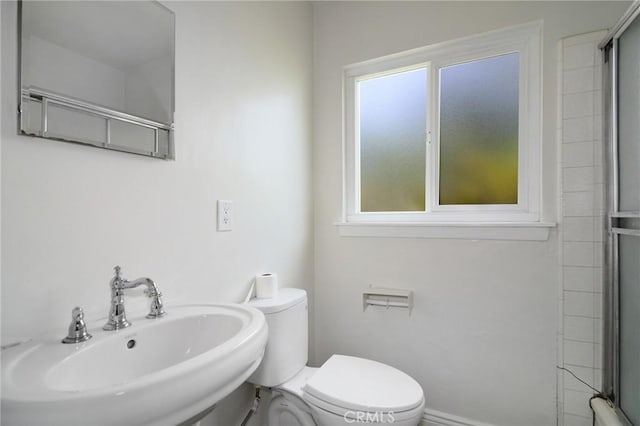 5655 Wish Ave, Encino, CA 91316 - bathroom featuring toilet, a shower with door, and a sink