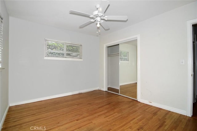 5655 Wish Ave, Encino, CA 91316 - unfurnished bedroom with wood finished floors, a closet, baseboards, and ceiling fan
