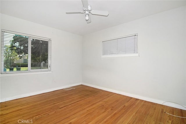 5655 Wish Ave, Encino, CA 91316 - spare room with baseboards, wood finished floors, and a ceiling fan