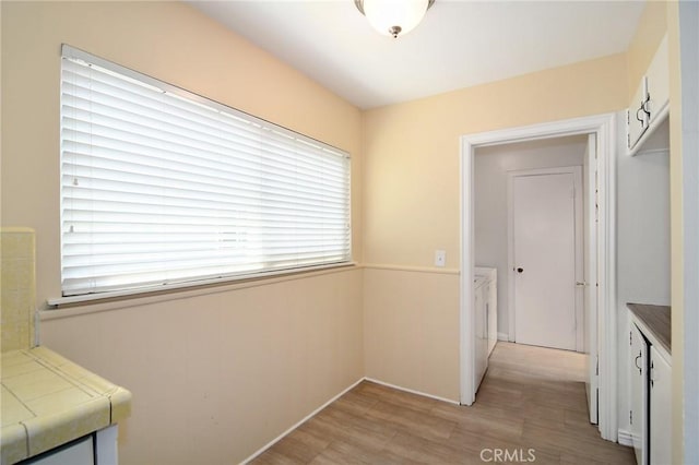 5655 Wish Ave, Encino, CA 91316 - hall with light wood finished floors and washer and dryer
