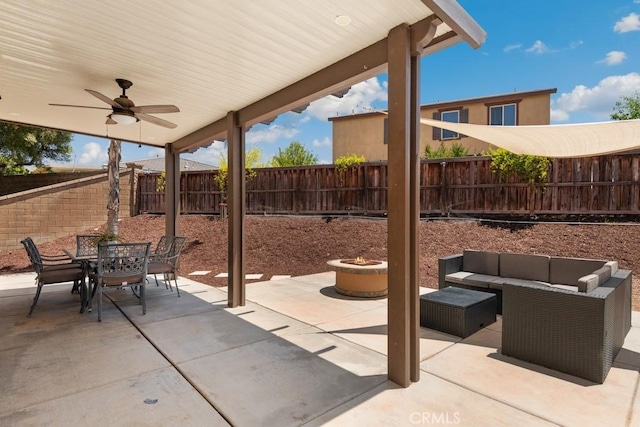 29463 Bouris Dr, Menifee, CA 92584 - fenced backyard with outdoor dining area, a patio, an outdoor living space with a fire pit, and a ceiling fan