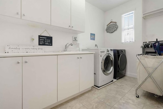 1327 Silver Hawk Way, Chula Vista, CA 91915 - laundry area featuring cabinet space, separate washer and dryer, and light tile patterned floors