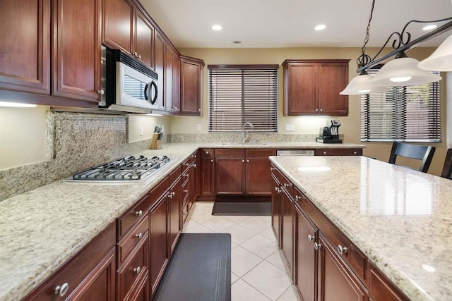 1327 Silver Hawk Way, Chula Vista, CA 91915 - kitchen with stainless steel appliances, pendant lighting, light tile patterned floors, light stone countertops, and recessed lighting