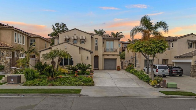 1327 Silver Hawk Way, Chula Vista, CA 91915 - mediterranean / spanish-style home featuring driveway, stucco siding, a balcony, an attached garage, and a tile roof