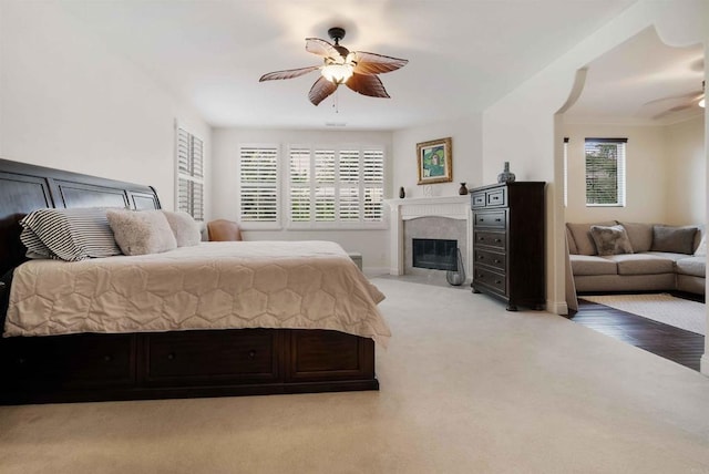 1327 Silver Hawk Way, Chula Vista, CA 91915 - bedroom featuring light colored carpet, multiple windows, a premium fireplace, and ceiling fan