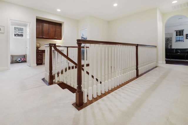 1327 Silver Hawk Way, Chula Vista, CA 91915 - corridor featuring arched walkways, recessed lighting, an upstairs landing, and light colored carpet