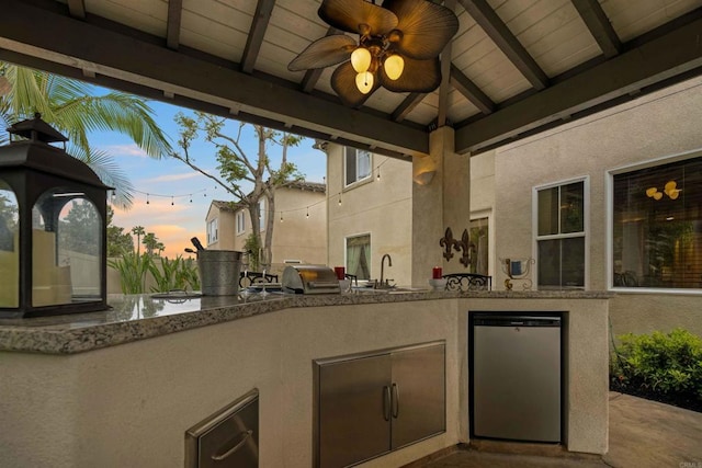 1327 Silver Hawk Way, Chula Vista, CA 91915 - patio terrace at dusk featuring ceiling fan, an outdoor kitchen, and a gazebo