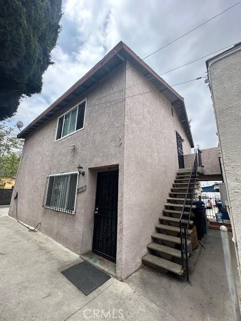 536 W Century Blvd, Los Angeles, CA 90044 - back of house featuring stucco siding and stairs
