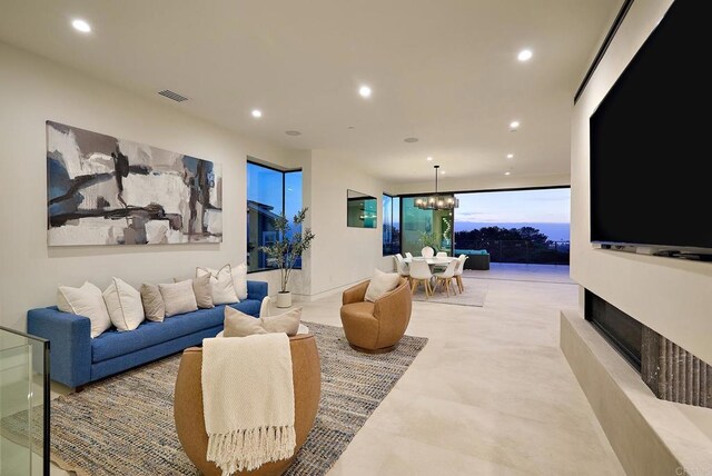 537 N Granados Ave, Solana Beach, CA 92075 - living area featuring recessed lighting, a chandelier, and a fireplace with raised hearth