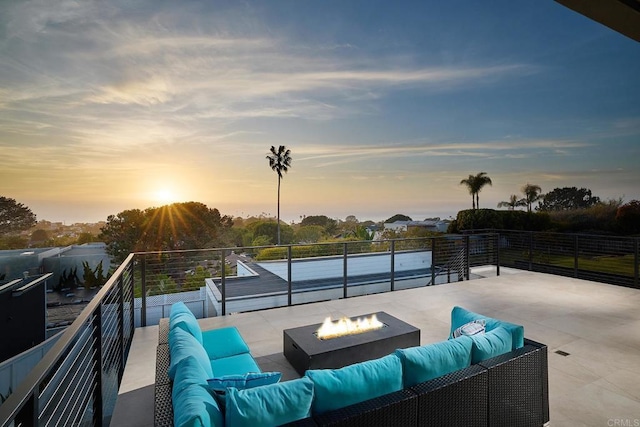 537 N Granados Ave, Solana Beach, CA 92075 - patio terrace at dusk featuring an outdoor living space with a fire pit