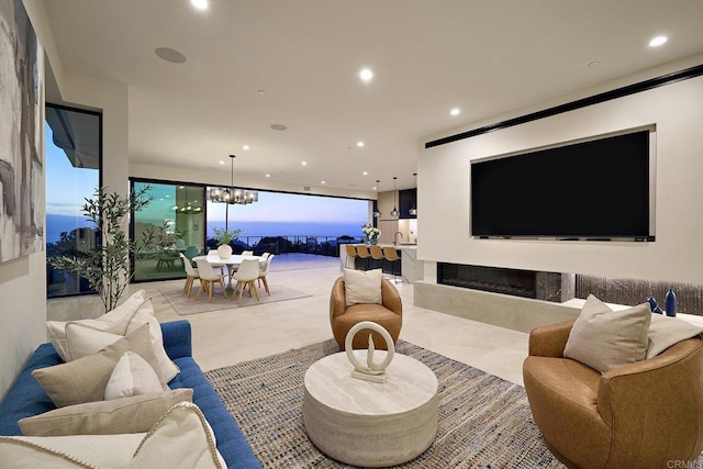 537 N Granados Ave, Solana Beach, CA 92075 - living area featuring recessed lighting, a chandelier, a fireplace, and a wall of windows