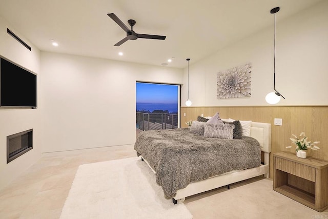 537 N Granados Ave, Solana Beach, CA 92075 - bedroom with wainscoting, ceiling fan, recessed lighting, a glass covered fireplace, and wood walls
