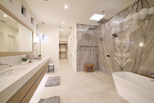 537 N Granados Ave, Solana Beach, CA 92075 - full bathroom featuring a marble finish shower, double vanity, a freestanding tub, a skylight, and recessed lighting
