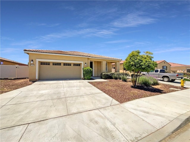 27117 Great Plains Ct, Menifee, CA 92585 - mediterranean / spanish-style home with concrete driveway, a garage, a tiled roof, and stucco siding