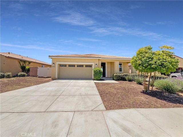 27117 Great Plains Ct, Menifee, CA 92585 - view of front facade featuring a garage, concrete driveway, stucco siding, and a tile roof