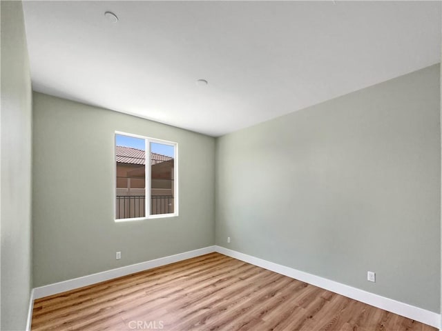 27117 Great Plains Ct, Menifee, CA 92585 - empty room with wood finished floors and baseboards