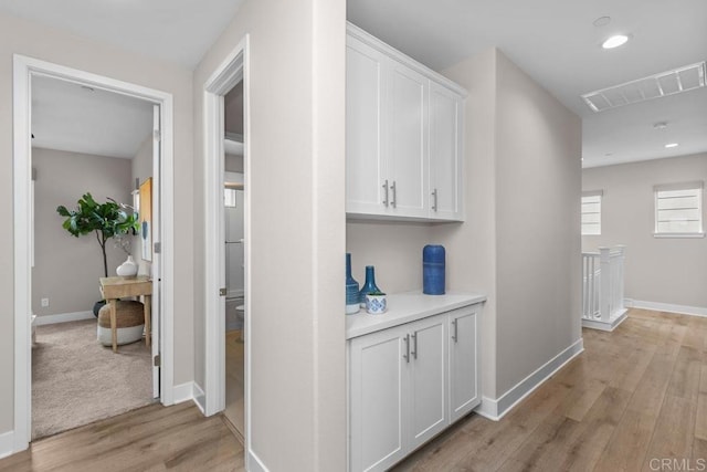 13403 Hudson Ln, San Diego, CA 92130 - hallway with light wood-style flooring, baseboards, recessed lighting, and an upstairs landing