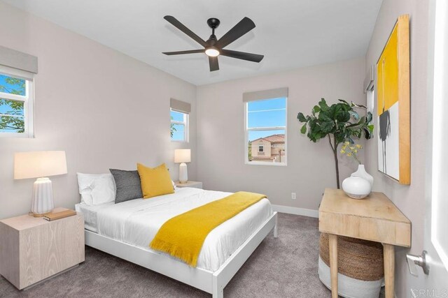 13403 Hudson Ln, San Diego, CA 92130 - carpeted bedroom featuring baseboards and a ceiling fan