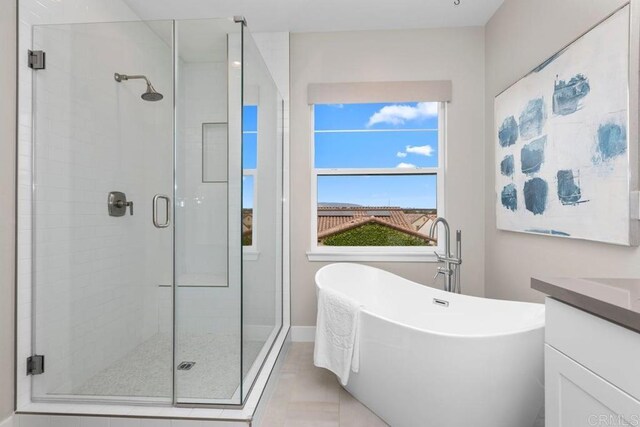 13403 Hudson Ln, San Diego, CA 92130 - full bath with a stall shower, plenty of natural light, a freestanding tub, and vanity
