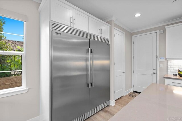 13403 Hudson Ln, San Diego, CA 92130 - kitchen featuring built in fridge, light wood-style floors, white cabinets, recessed lighting, and light countertops