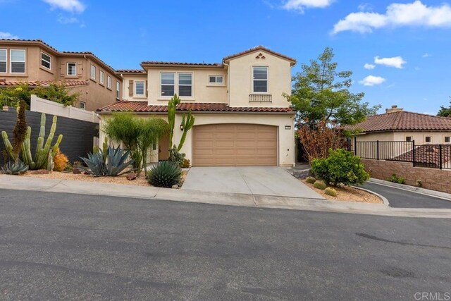 13403 Hudson Ln, San Diego, CA 92130 - mediterranean / spanish-style house featuring stucco siding, driveway, a garage, and a tiled roof
