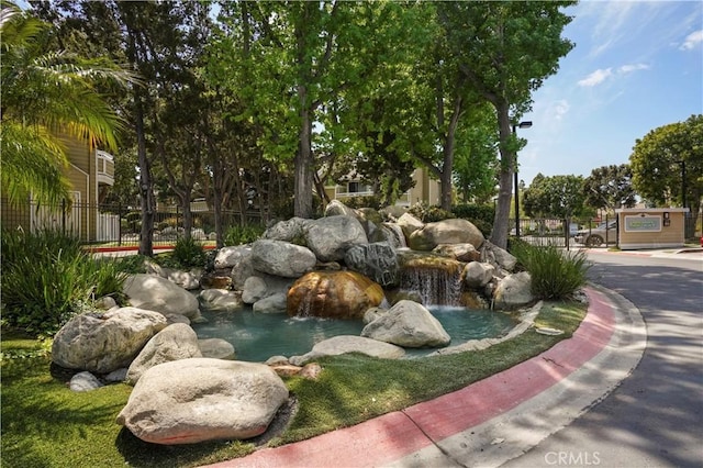 3690 S Bear St Unit 5, Santa Ana, CA 92704 - view of home's community with a garden pond
