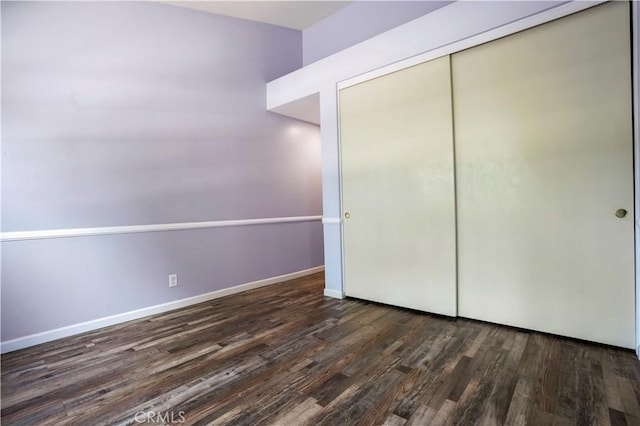 3690 S Bear St Unit 5, Santa Ana, CA 92704 - unfurnished bedroom featuring wood finished floors, a closet, and baseboards