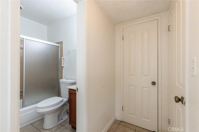 1437 S Gaffey St, San Pedro, CA 90731 - bathroom with tile patterned floors, a stall shower, vanity, toilet, and a textured ceiling