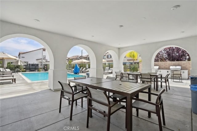 24117 Dolcetto Ave Unit 104, Murrieta, CA 92562 - view of patio / terrace featuring a community pool, outdoor dining area, and a grill