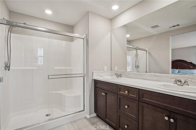 24117 Dolcetto Ave Unit 104, Murrieta, CA 92562 - ensuite bathroom featuring a shower stall and double vanity