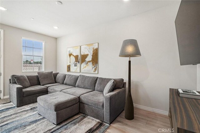 24117 Dolcetto Ave Unit 104, Murrieta, CA 92562 - living area featuring baseboards, light wood-style flooring, and recessed lighting