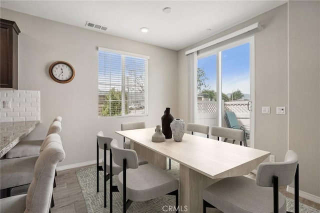 24117 Dolcetto Ave Unit 104, Murrieta, CA 92562 - dining area with baseboards and wood finished floors