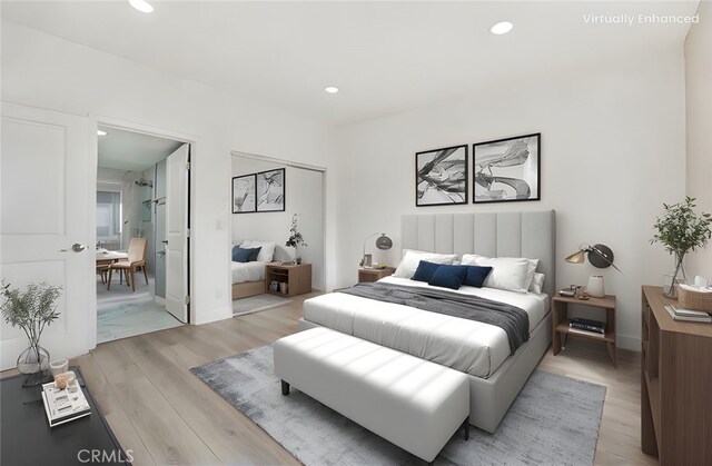 11150 Glenoaks Blvd Unit 106, Pacoima, CA 91331 - bedroom featuring light wood-type flooring, recessed lighting, and baseboards