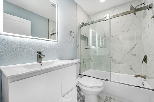 11150 Glenoaks Blvd Unit 106, Pacoima, CA 91331 - full bathroom with vanity, toilet, bath / shower combo with glass door, a textured wall, and marble look tiles