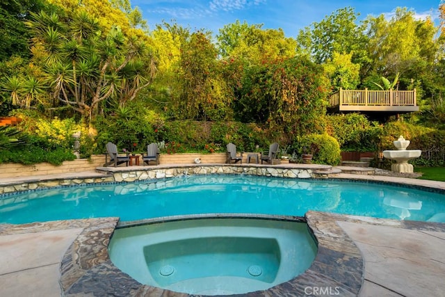 1180 Calle Pecos, Thousand Oaks, CA 91360 - view of pool with a patio area, a pool with connected hot tub, and view of scattered trees