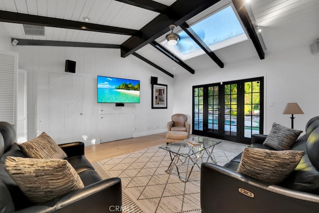 1180 Calle Pecos, Thousand Oaks, CA 91360 - living area featuring light wood-style flooring, a skylight, baseboards, and wood walls