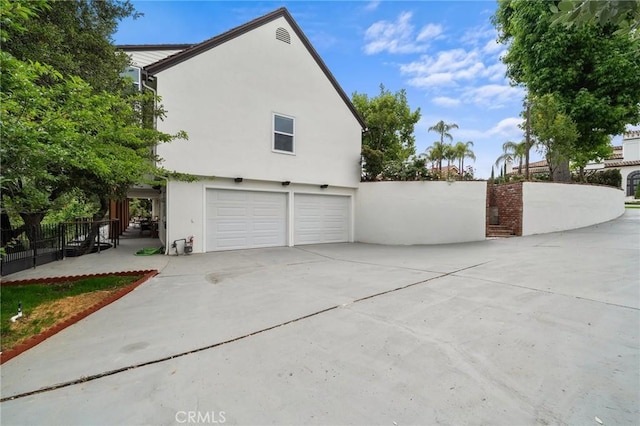 22621 Ridge Line Rd, Diamond Bar, CA 91765 - view of property exterior with an attached garage, stucco siding, and driveway
