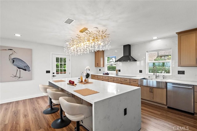 22621 Ridge Line Rd, Diamond Bar, CA 91765 - kitchen with wall chimney range hood, dishwasher, a sink, a breakfast bar, and light countertops