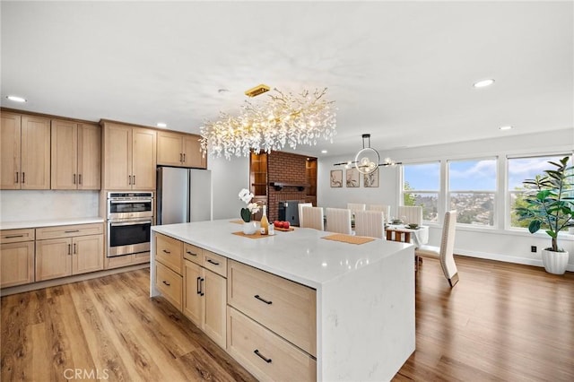 22621 Ridge Line Rd, Diamond Bar, CA 91765 - kitchen featuring a chandelier, recessed lighting, appliances with stainless steel finishes, light wood-style flooring, and light countertops