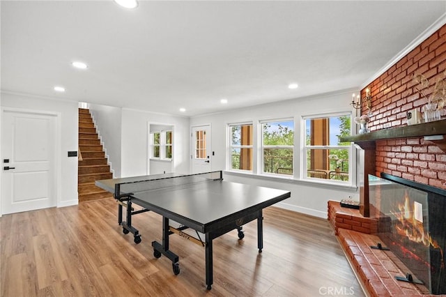 22621 Ridge Line Rd, Diamond Bar, CA 91765 - rec room with ornamental molding, baseboards, wood finished floors, recessed lighting, and a brick fireplace