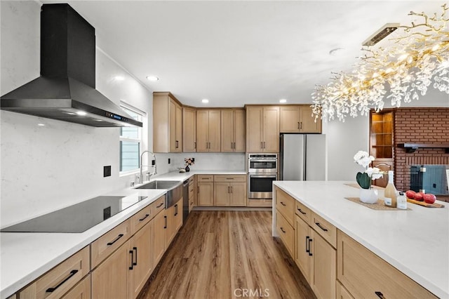 22621 Ridge Line Rd, Diamond Bar, CA 91765 - kitchen featuring wall chimney exhaust hood, a sink, light brown cabinets, stainless steel appliances, and light wood-style flooring