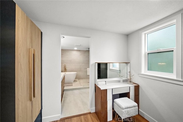 22621 Ridge Line Rd, Diamond Bar, CA 91765 - bedroom featuring light wood-type flooring, baseboards, and ensuite bathroom