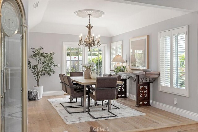 21035 Timber Ridge Rd, Yorba Linda, CA 92886 - dining area featuring a chandelier, wood finished floors, and healthy amount of natural light