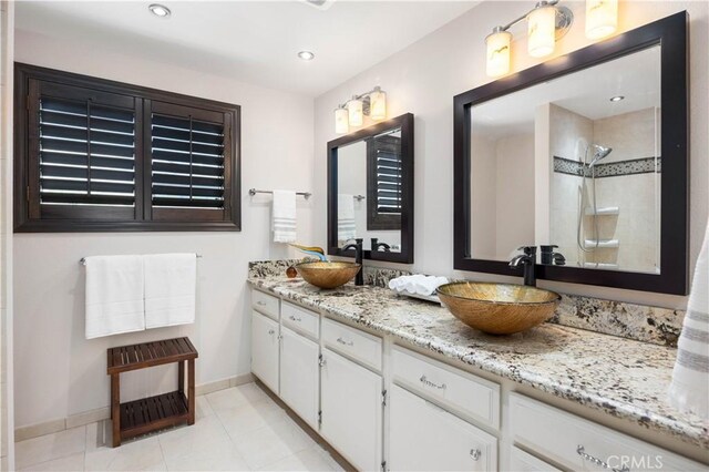 21035 Timber Ridge Rd, Yorba Linda, CA 92886 - full bath featuring double vanity, tile patterned floors, recessed lighting, and a tile shower