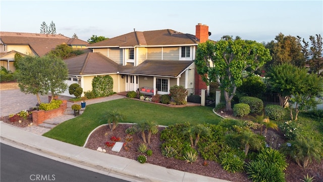 21035 Timber Ridge Rd, Yorba Linda, CA 92886 - traditional-style home with a tile roof, a chimney, and stucco siding