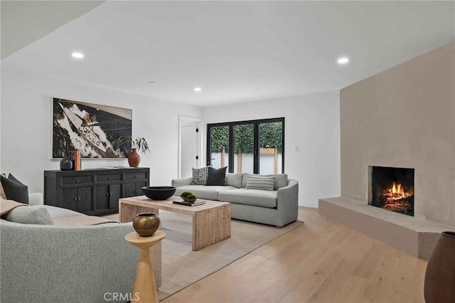 2416 Palm Ave, Manhattan Beach, CA 90266 - living area with light wood-type flooring, a large fireplace, and recessed lighting