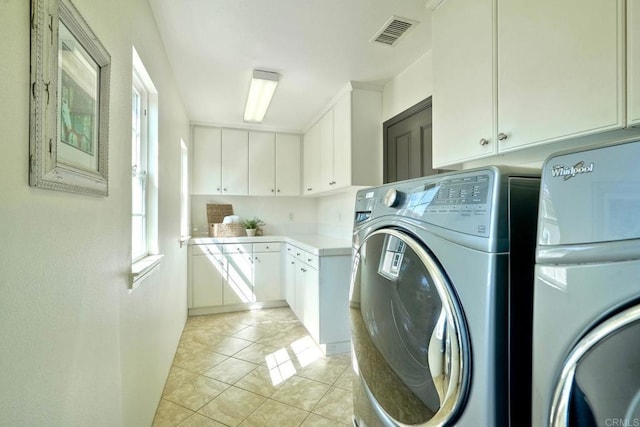 3518 Camino Cereza, Carlsbad, CA 92009 - washroom with cabinet space, washer and dryer, and light tile patterned flooring