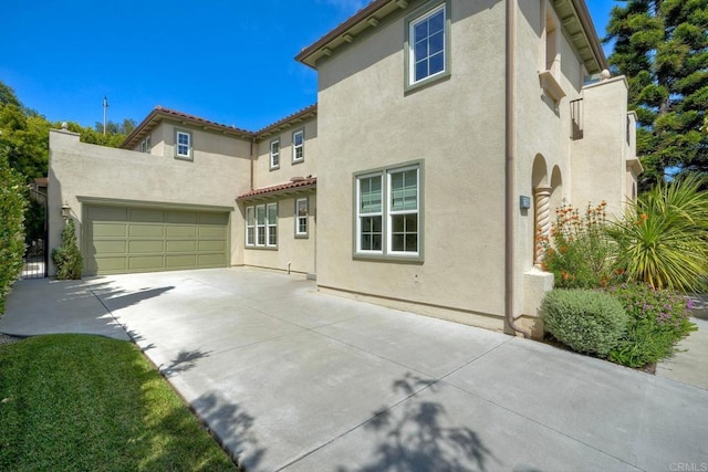 3518 Camino Cereza, Carlsbad, CA 92009 - view of front of property featuring driveway, stucco siding, and an attached garage