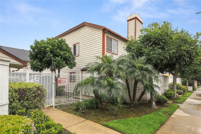 25520 Dodge Ave Unit A, Harbor City, CA 90710 - view of home's exterior featuring a chimney